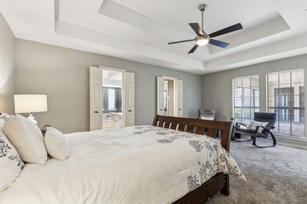 4130 High Star Lane Dallas, TX 75287 - Photo 21 of 38 a bedroom with a bed and window