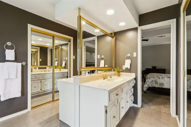 a bathroom with a bathtub and a window