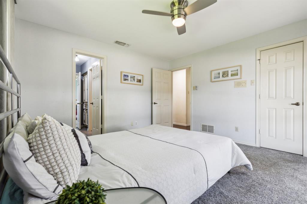 4130 High Star Lane Dallas, TX 75287 - Photo 28 of 38 a bedroom with a bed flowerpot and window