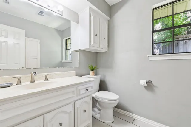 a bedroom with a bunk bed and a desk