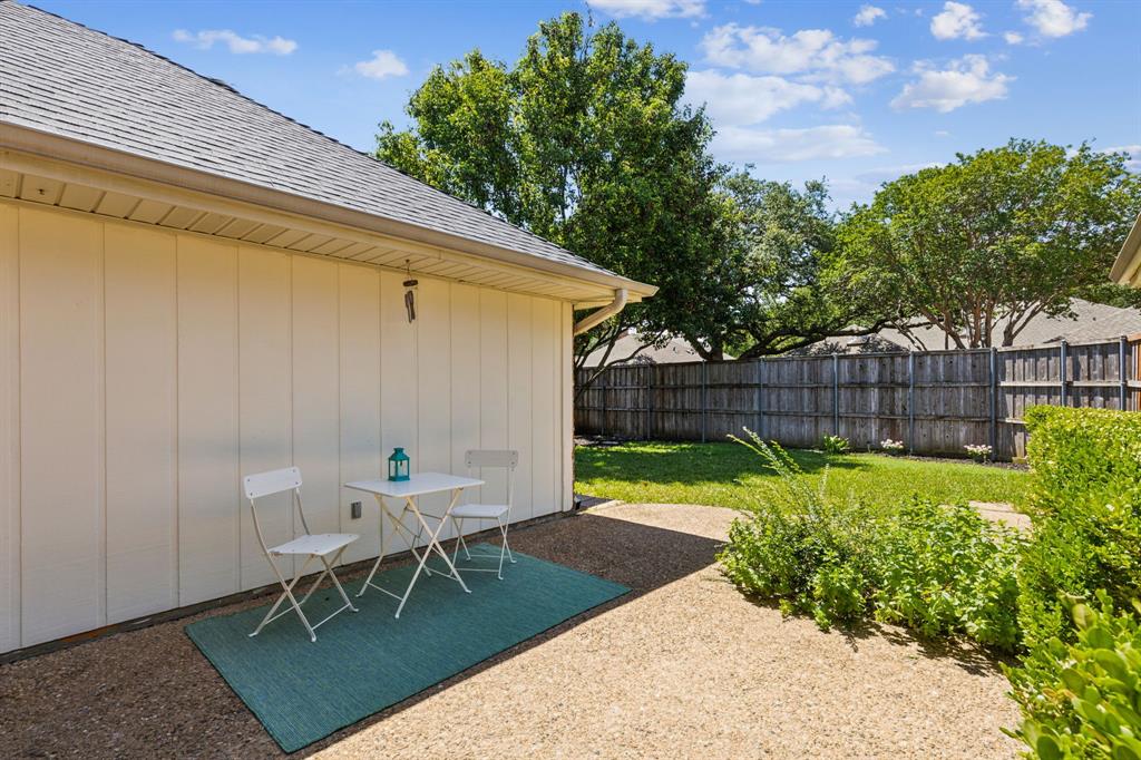 4130 High Star Lane Dallas, TX 75287 - Photo 34 of 38 a backyard with a table and chairs