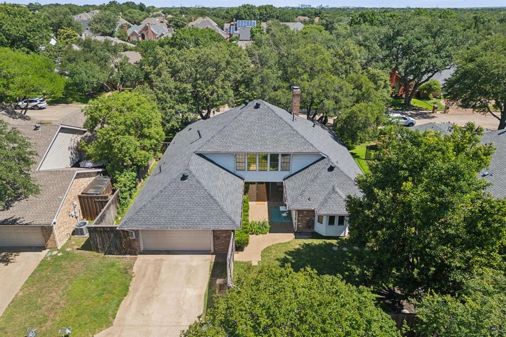 4130 High Star Lane Dallas, TX 75287 - Photo 36 of 38 an aerial view of a house with a yard and large trees