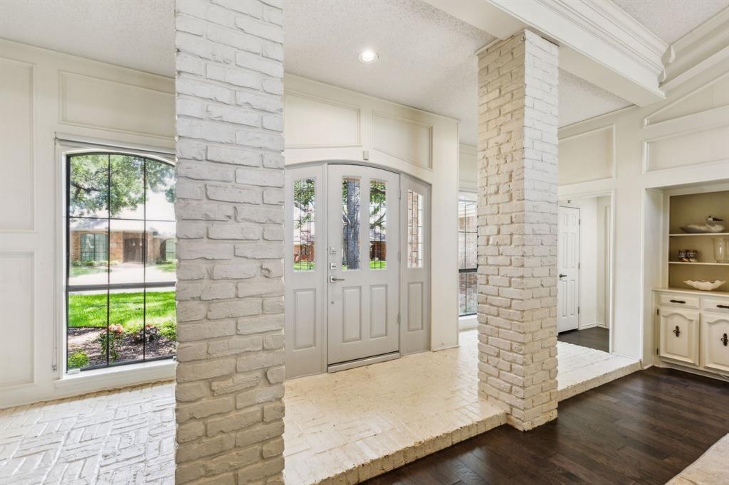 4130 High Star Lane Dallas, TX 75287 - Photo 7 of 38 a view of entryway with wooden floor