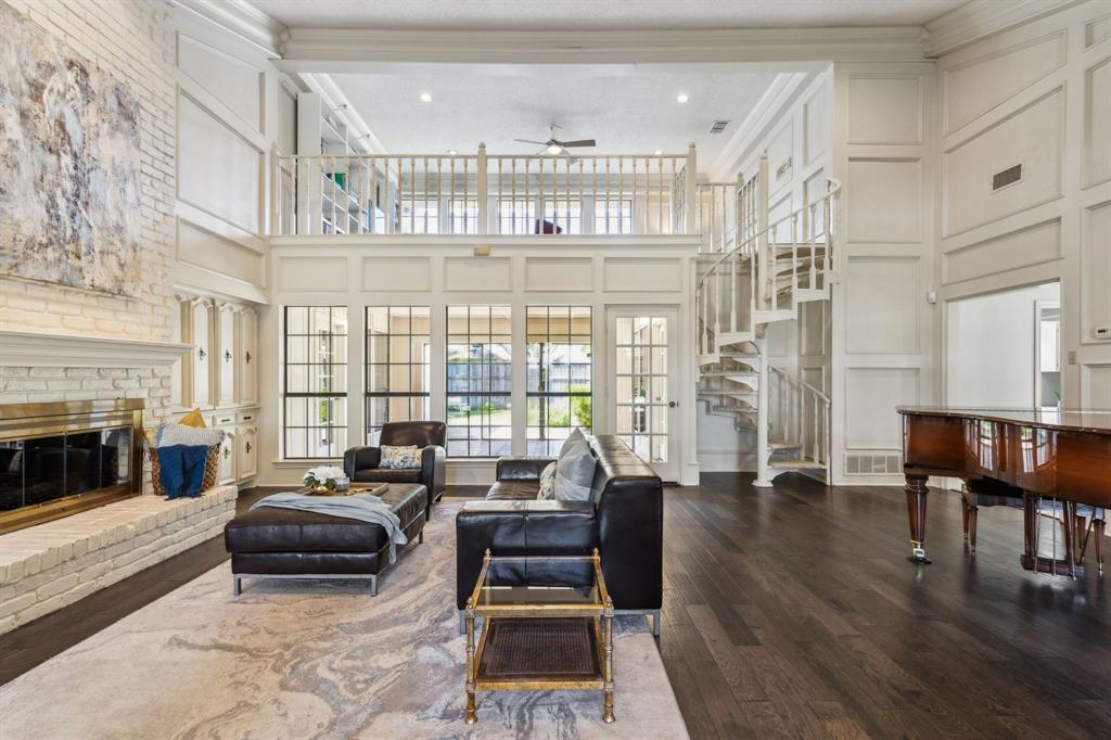 4130 High Star Lane Dallas, TX 75287 - Photo 8 of 38 a living room with furniture a fireplace and a table