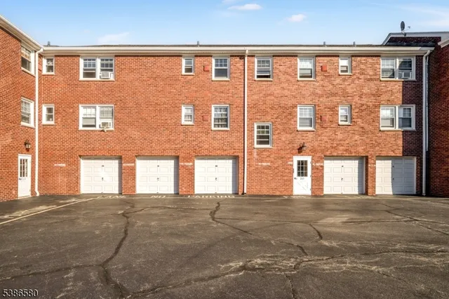 a front view of a building with many windows