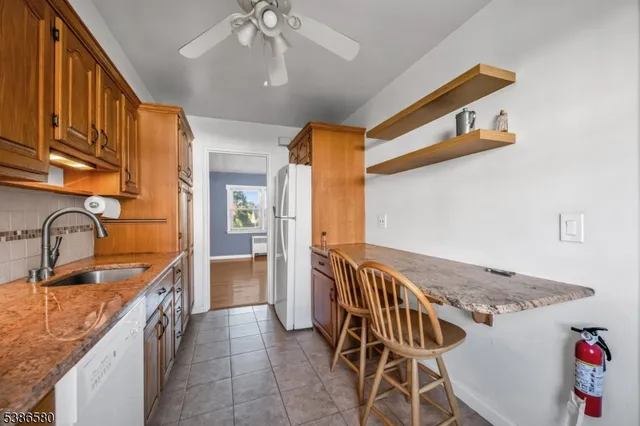 a kitchen with a sink and a stove top oven