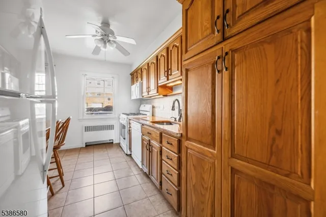 a kitchen with stainless steel appliances a refrigerator and a sink