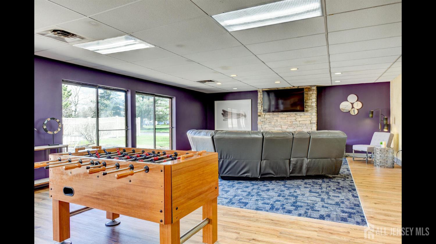 356 Ridge Road, Unit J12 Dayton, NJ 08810 - Photo 11 of 21 a living room with a couch and a fireplace