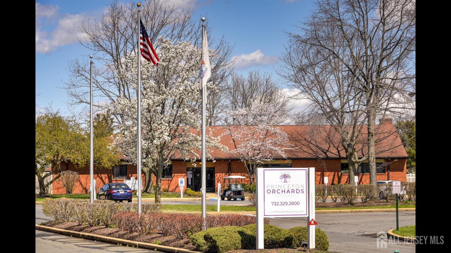 356 Ridge Road, Unit J12 Dayton, NJ 08810 - Photo 2 of 21 a sign on the side of a building