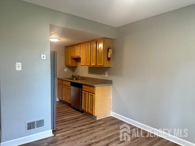 356 Ridge Road, Unit J12 Dayton, NJ 08810 - Photo 26 of 42 a kitchen with granite countertop a sink and a stove top oven