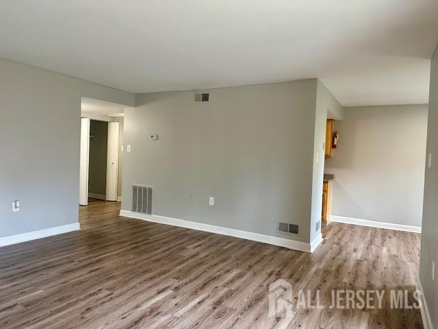 356 Ridge Road, Unit J12 Dayton, NJ 08810 - Photo 29 of 42 a view of an empty room with wooden floor and closet