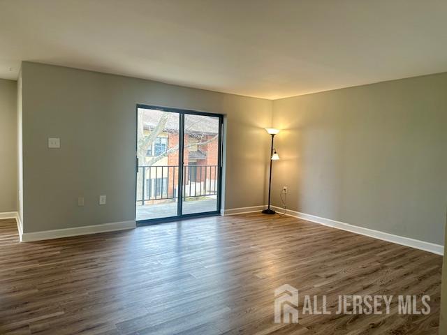356 Ridge Road, Unit J12 Dayton, NJ 08810 - Photo 31 of 42 an empty room with wooden floor and windows