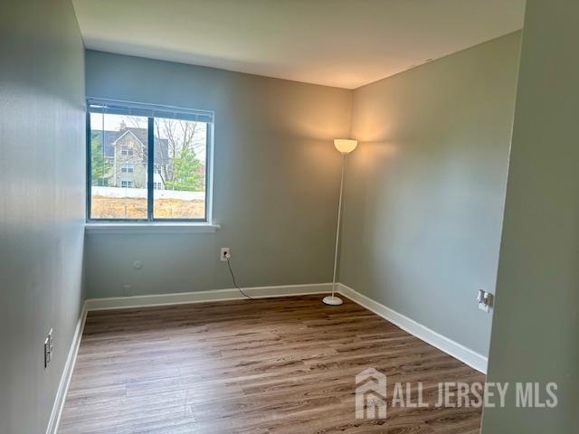 356 Ridge Road, Unit J12 Dayton, NJ 08810 - Photo 38 of 42 a view of a room with wooden floor and window