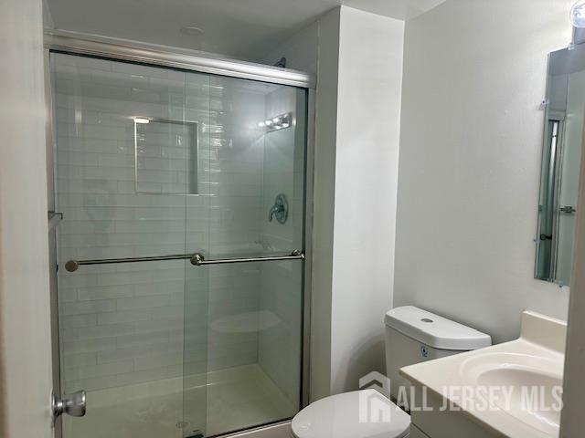 356 Ridge Road, Unit J12 Dayton, NJ 08810 - Photo 42 of 42 a bathroom with a shower and toilet