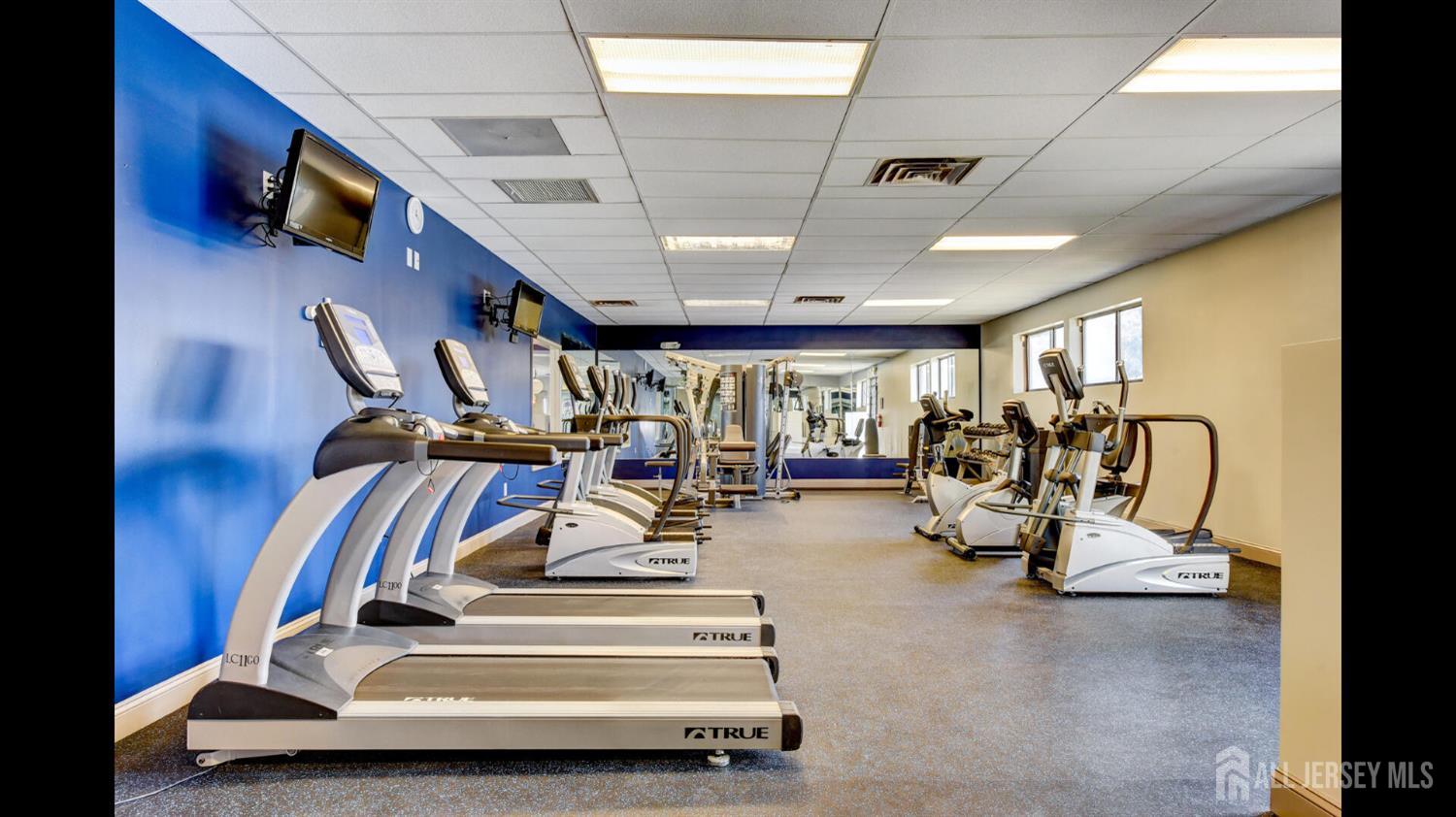 356 Ridge Road, Unit J12 Dayton, NJ 08810 - Photo 7 of 21 a view of a room with gym equipment