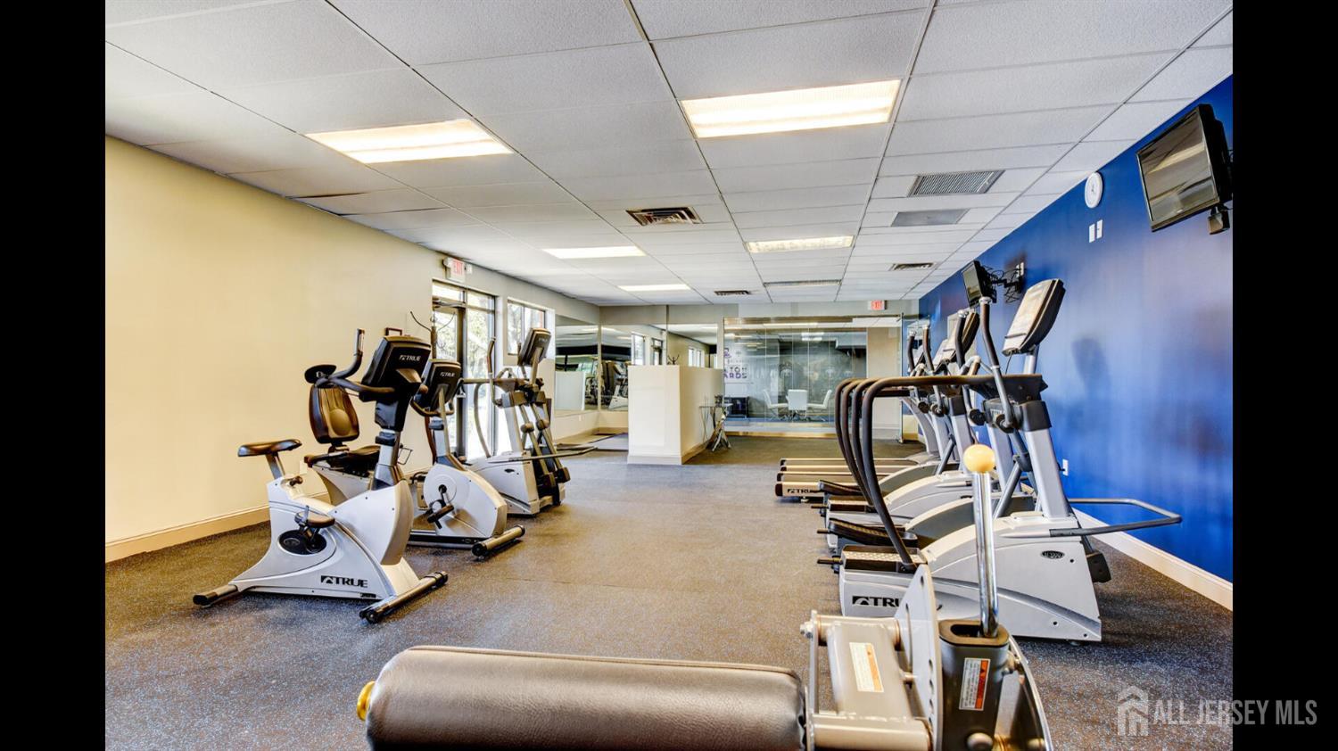 356 Ridge Road, Unit J12 Dayton, NJ 08810 - Photo 8 of 21 a view of a room with gym equipment
