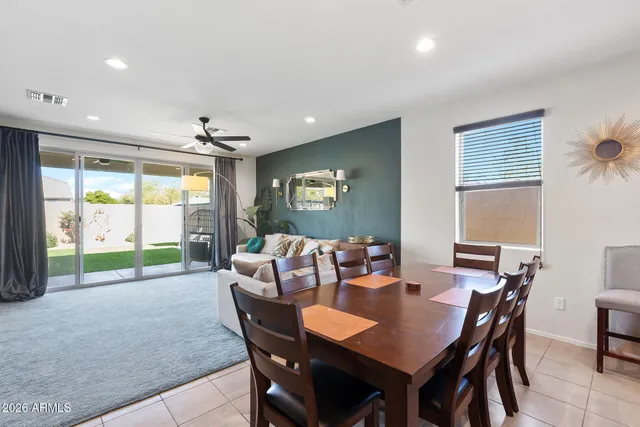a large kitchen with kitchen island a dining table and chairs