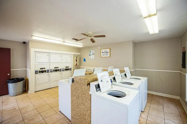 a kitchen with stainless steel appliances kitchen island granite countertop a sink and cabinets