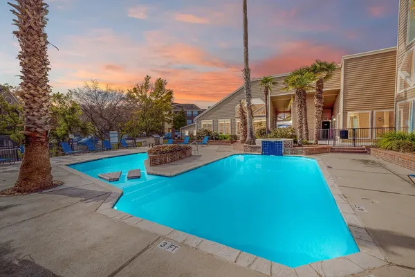 a view of a swimming pool with a lounge chairs