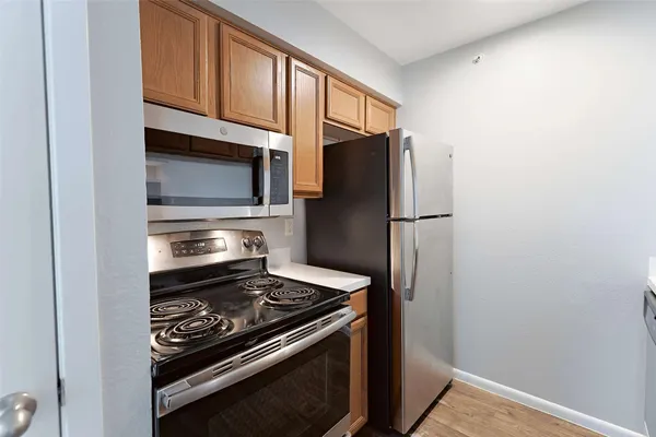 a kitchen with a stove microwave and refrigerator