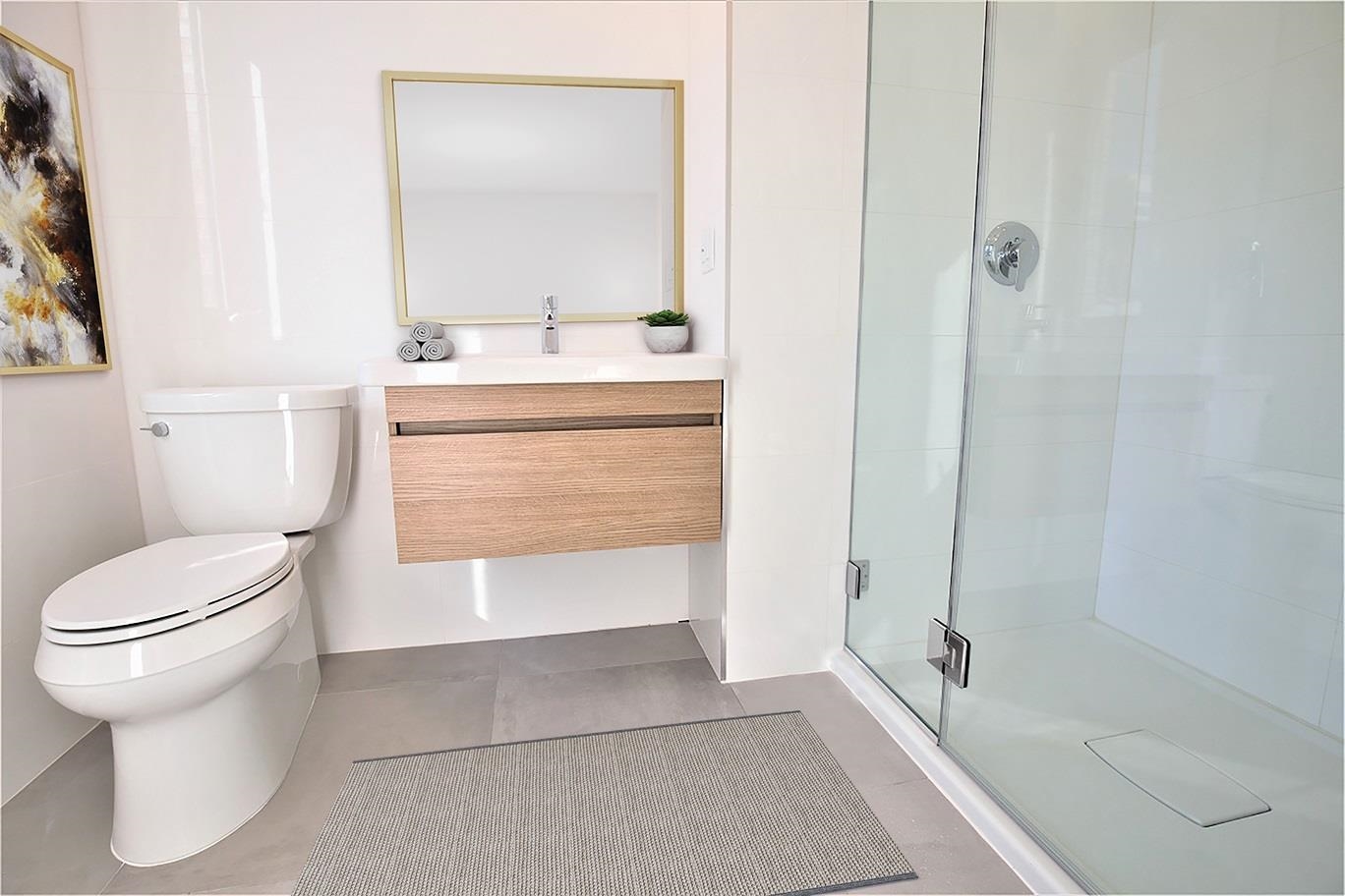 110 Court Street, Unit 2 Hoboken, NJ 07030 - Photo 11 of 14 a bathroom with a sink a toilet and shower
