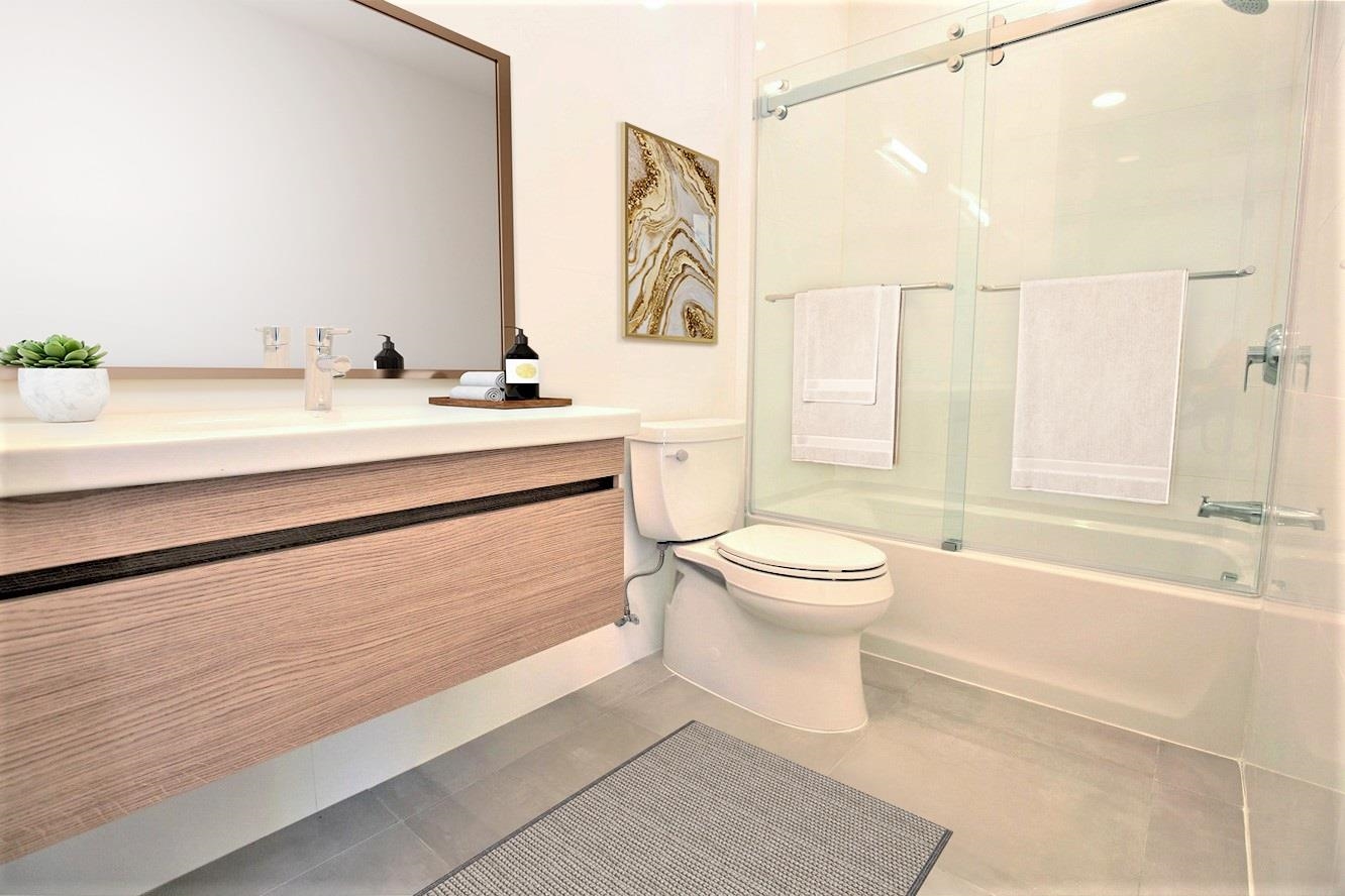 110 Court Street, Unit 2 Hoboken, NJ 07030 - Photo 12 of 14 a bathroom with a sink a toilet and a bathtub