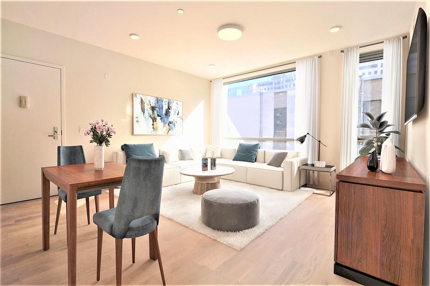 110 Court Street, Unit 2 Hoboken, NJ 07030 - Photo 3 of 14 a living room with furniture and a large window
