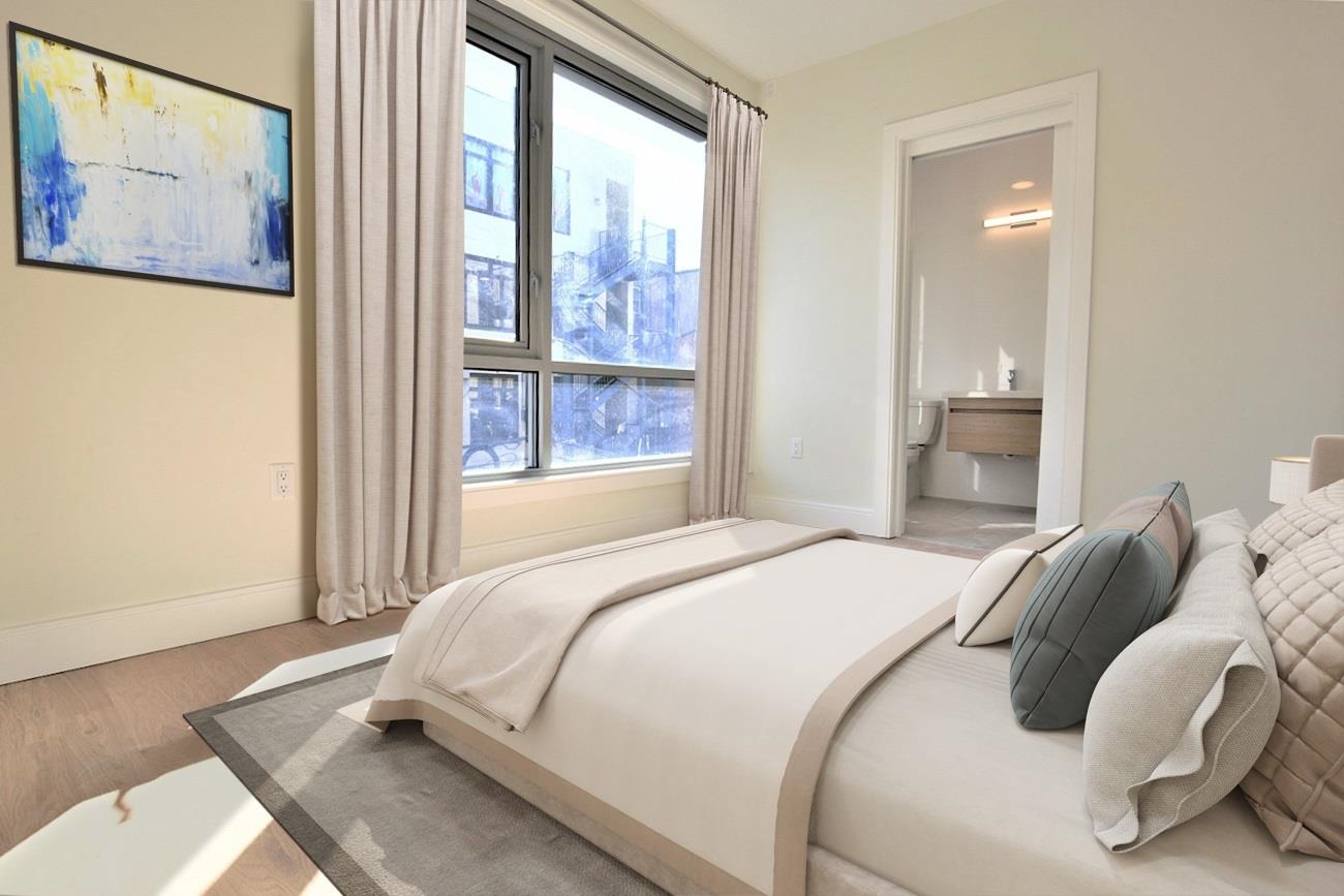 110 Court Street, Unit 2 Hoboken, NJ 07030 - Photo 5 of 14 a bedroom with a bed and wooden floor