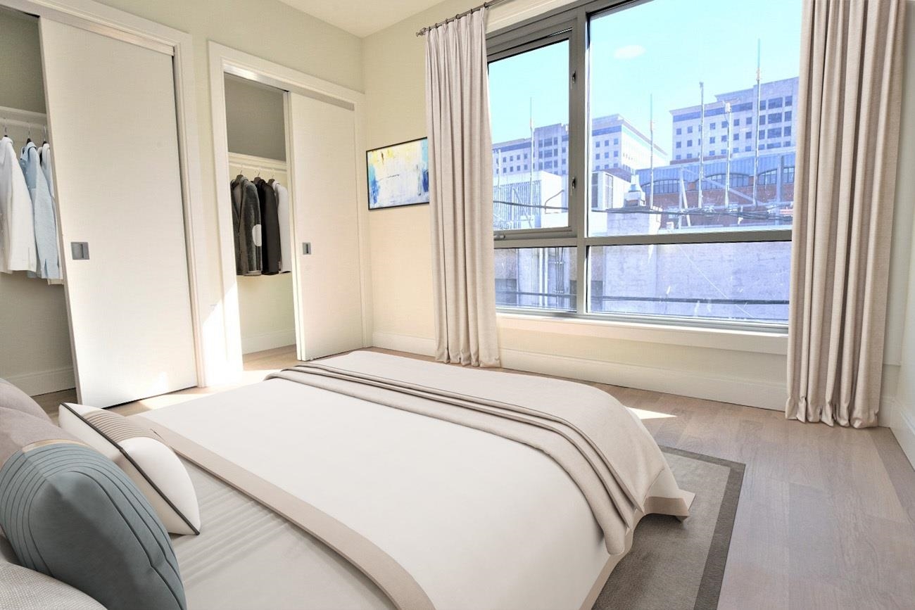 110 Court Street, Unit 2 Hoboken, NJ 07030 - Photo 9 of 14 a bedroom with a bed and a large window with outer view