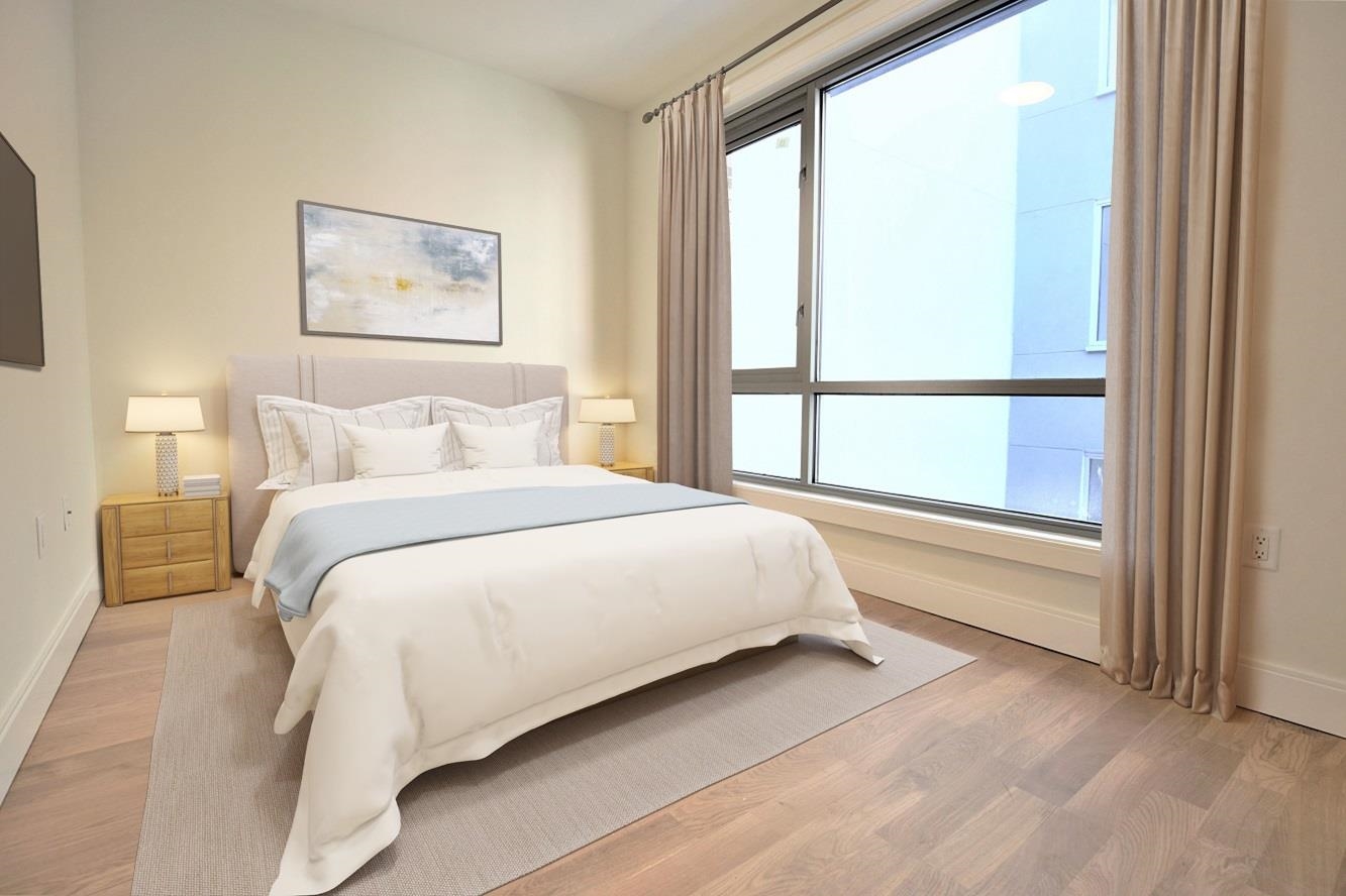 110 Court Street, Unit 2 Hoboken, NJ 07030 - Photo 10 of 14 a bedroom with a large bed and a window