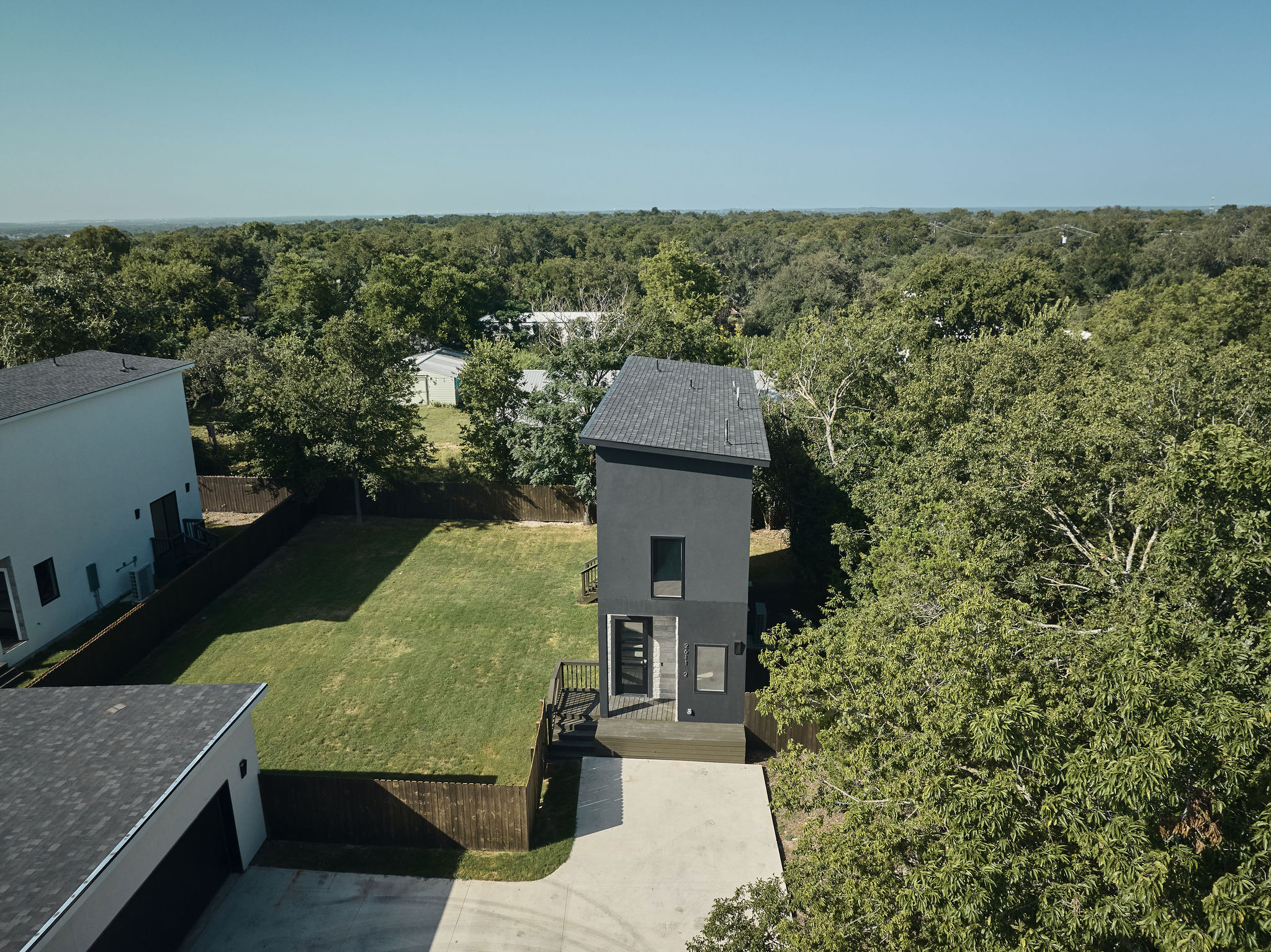 2611 Davis Lane, Unit 2 Austin, TX 78745 - Photo 2 of 23 View of subject property featuring a forest