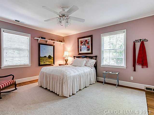 2035 Ferncliff Road Charlotte, NC 28211 - Photo 12 of 16 a bedroom with a bed and a couch