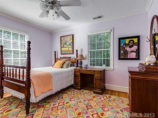 2035 Ferncliff Road Charlotte, NC 28211 - Photo 13 of 16 a bedroom with a bed and wooden floor