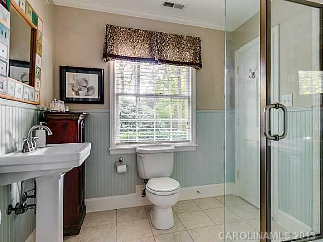 2035 Ferncliff Road Charlotte, NC 28211 - Photo 14 of 16 a bathroom with a toilet sink and shower