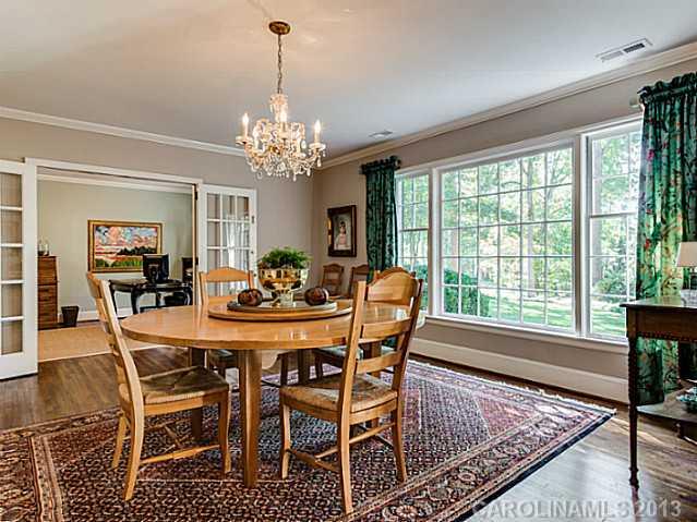 2035 Ferncliff Road Charlotte, NC 28211 - Photo 3 of 16 a view of a dining room with furniture window and wooden floor