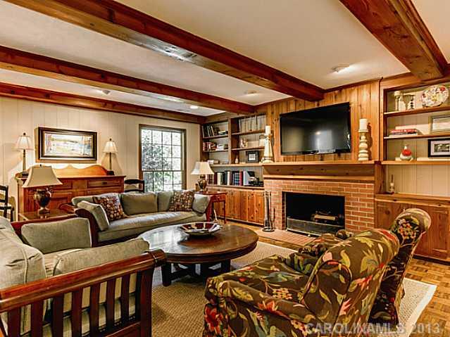 2035 Ferncliff Road Charlotte, NC 28211 - Photo 4 of 16 a living room with furniture a flat screen tv and a fireplace