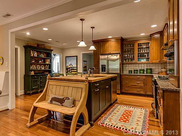 2035 Ferncliff Road Charlotte, NC 28211 - Photo 6 of 16 a kitchen with stainless steel appliances granite countertop a stove a sink and a refrigerator