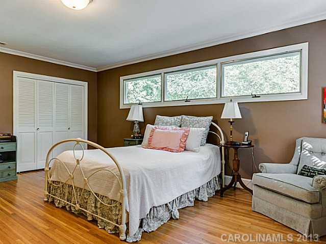 2035 Ferncliff Road Charlotte, NC 28211 - Photo 9 of 16 a bedroom with a bed and window