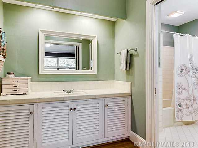 2035 Ferncliff Road Charlotte, NC 28211 - Photo 10 of 16 a bathroom with a sink and a mirror