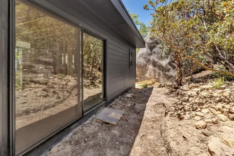 a view of a yard from a balcony