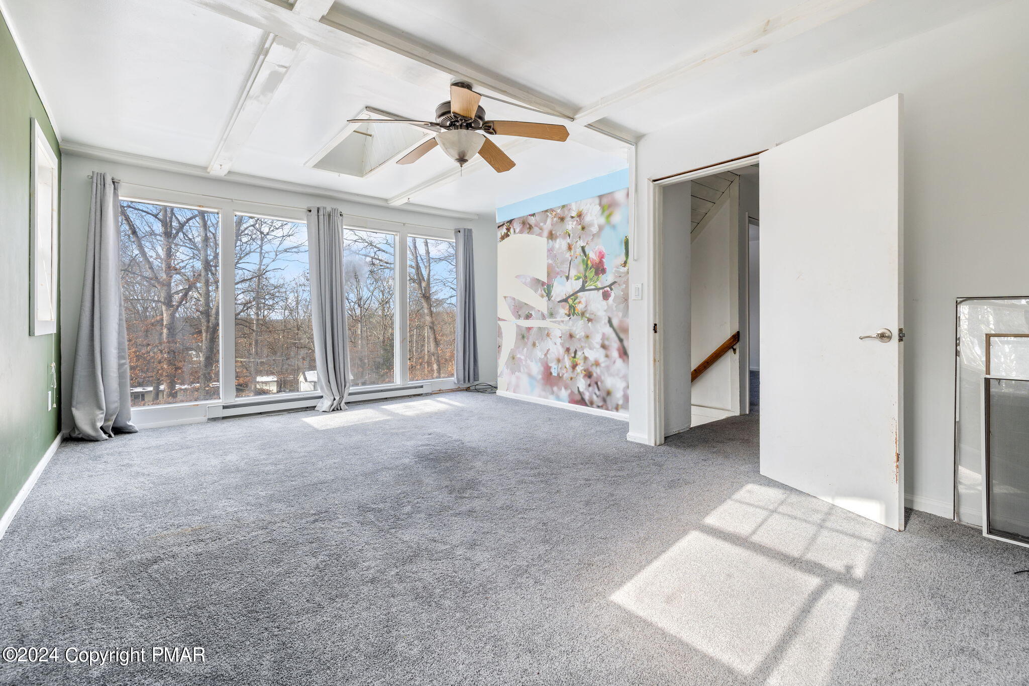 3118 Long Court Bushkill, PA 18324 - Photo 20 of 28 an empty room with windows and chandelier