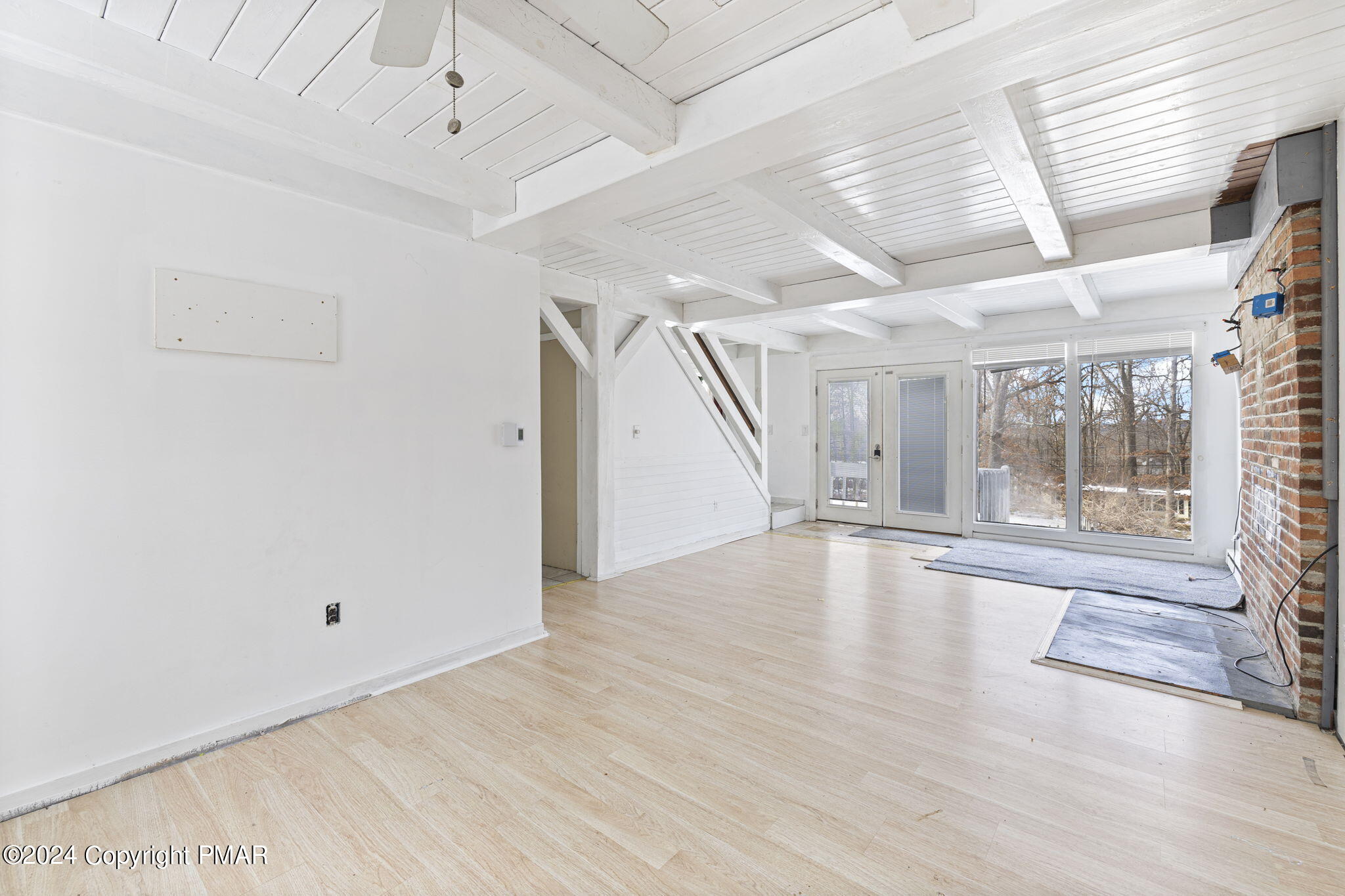 3118 Long Court Bushkill, PA 18324 - Photo 8 of 28 a view of empty room with wooden floor and fan