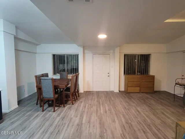 a floor to ceiling window and wooden floor
