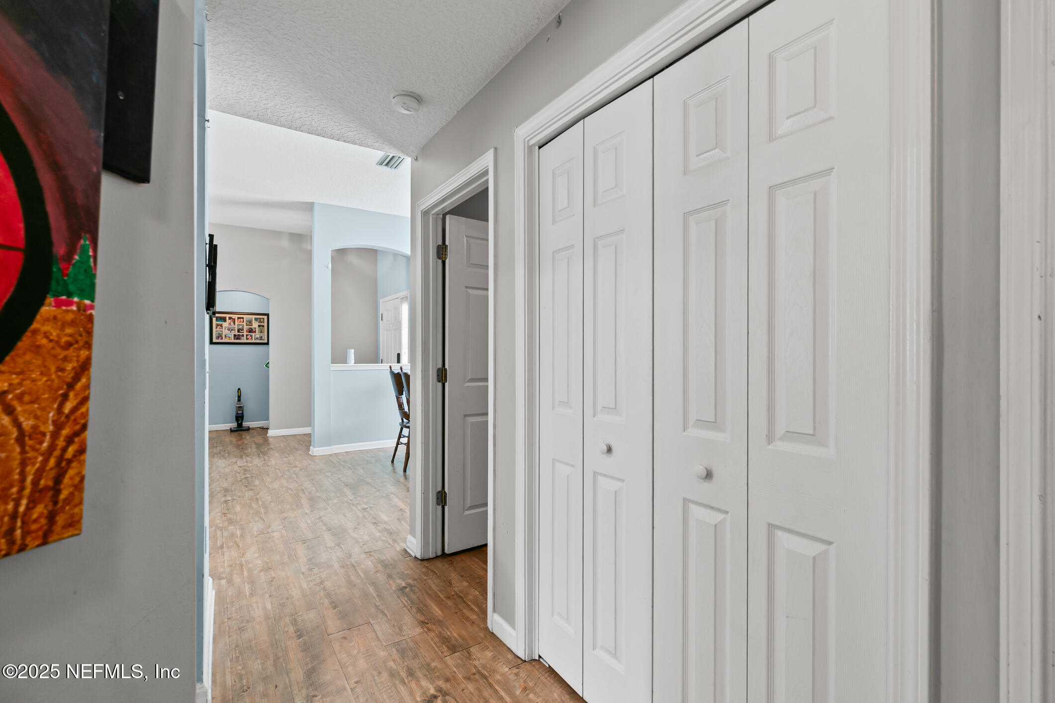 1725 South Summer Ridge Court St. Augustine, FL 32092 - Photo 12 of 46 a view of a hallway with wooden floor and entryway
