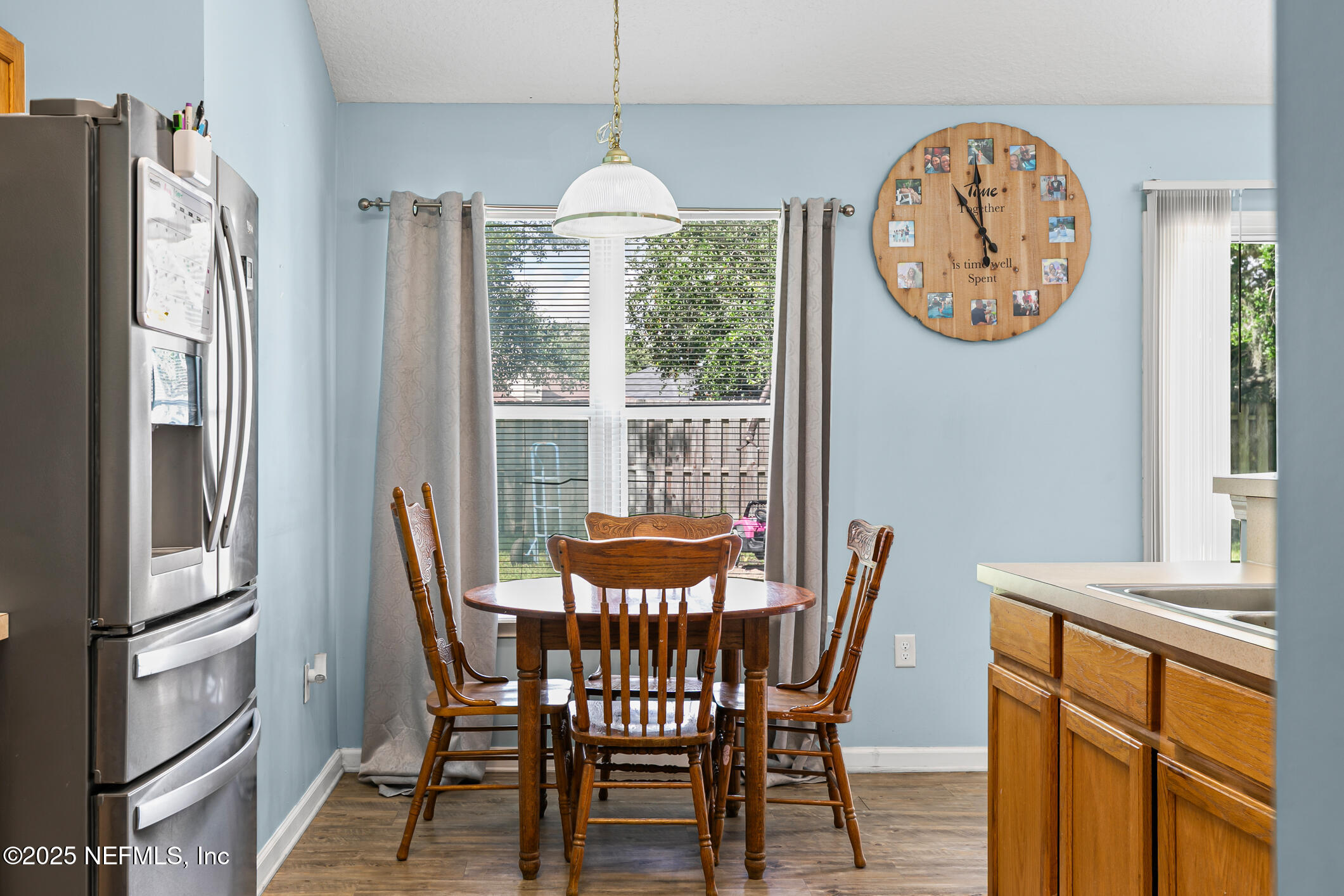 1725 South Summer Ridge Court St. Augustine, FL 32092 - Photo 14 of 46 a view of a dining room with furniture window and wooden floor