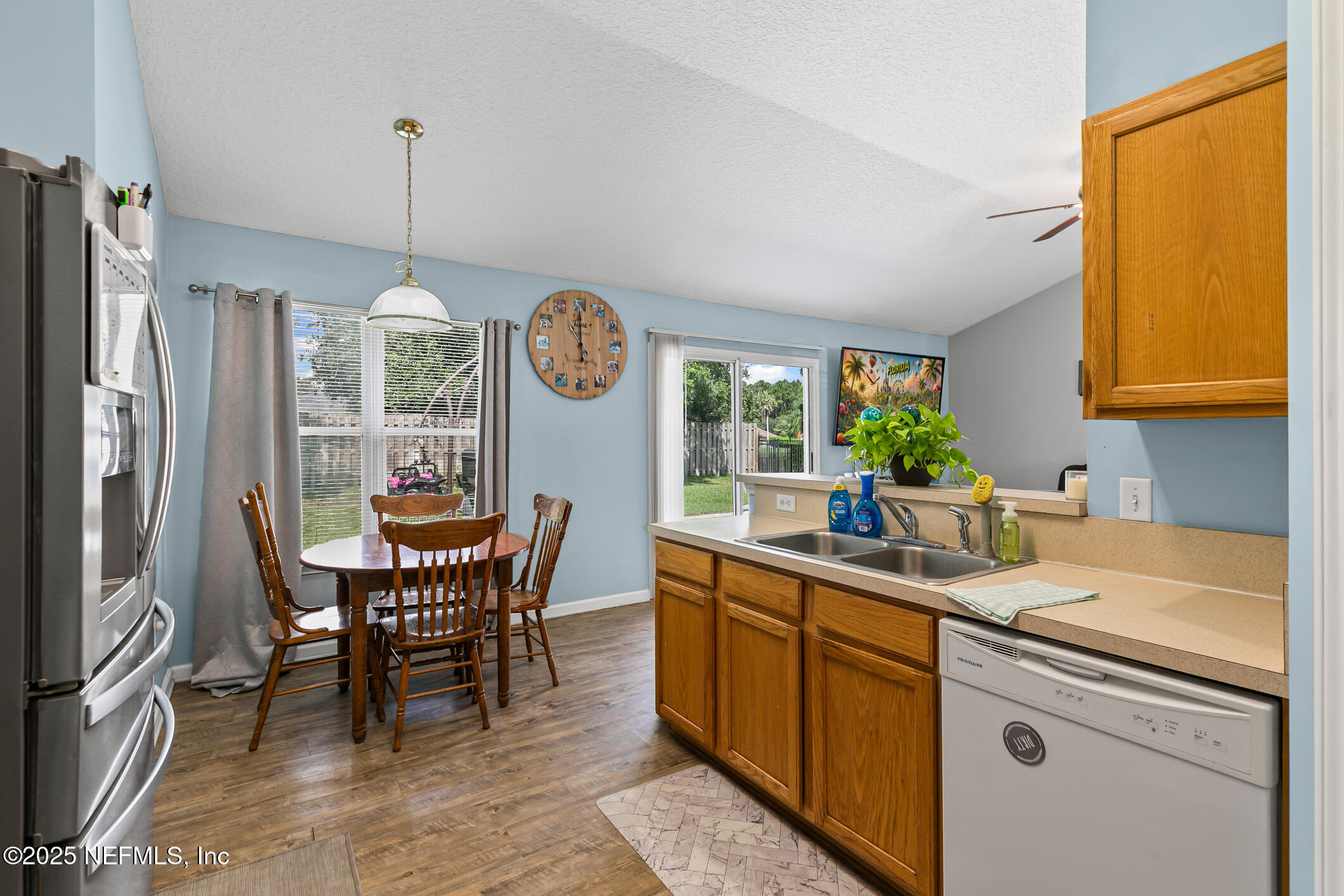 1725 South Summer Ridge Court St. Augustine, FL 32092 - Photo 16 of 46 a kitchen with a sink a counter space appliances and cabinets