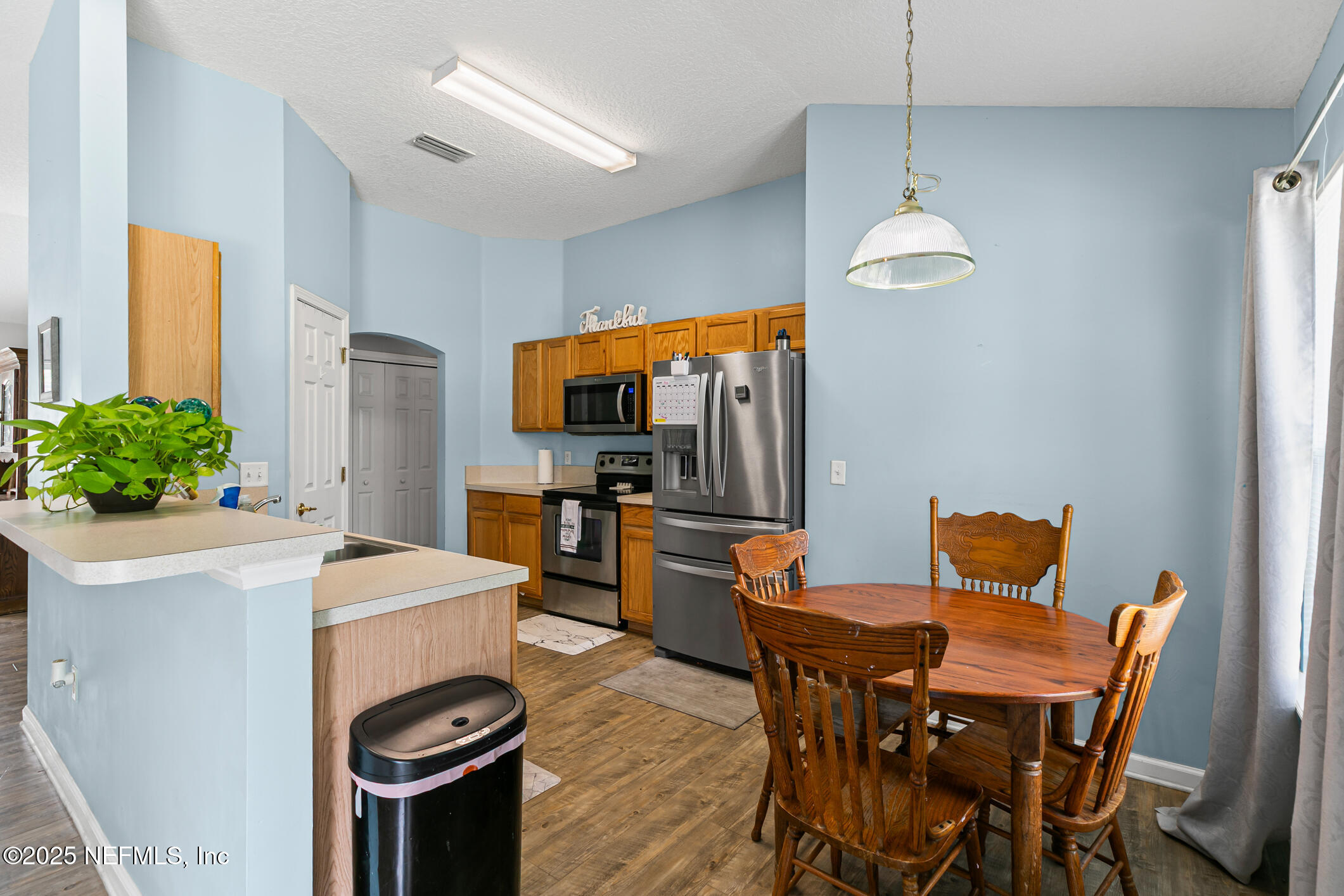 1725 South Summer Ridge Court St. Augustine, FL 32092 - Photo 17 of 46 a view of a dining room with furniture and a chandelier