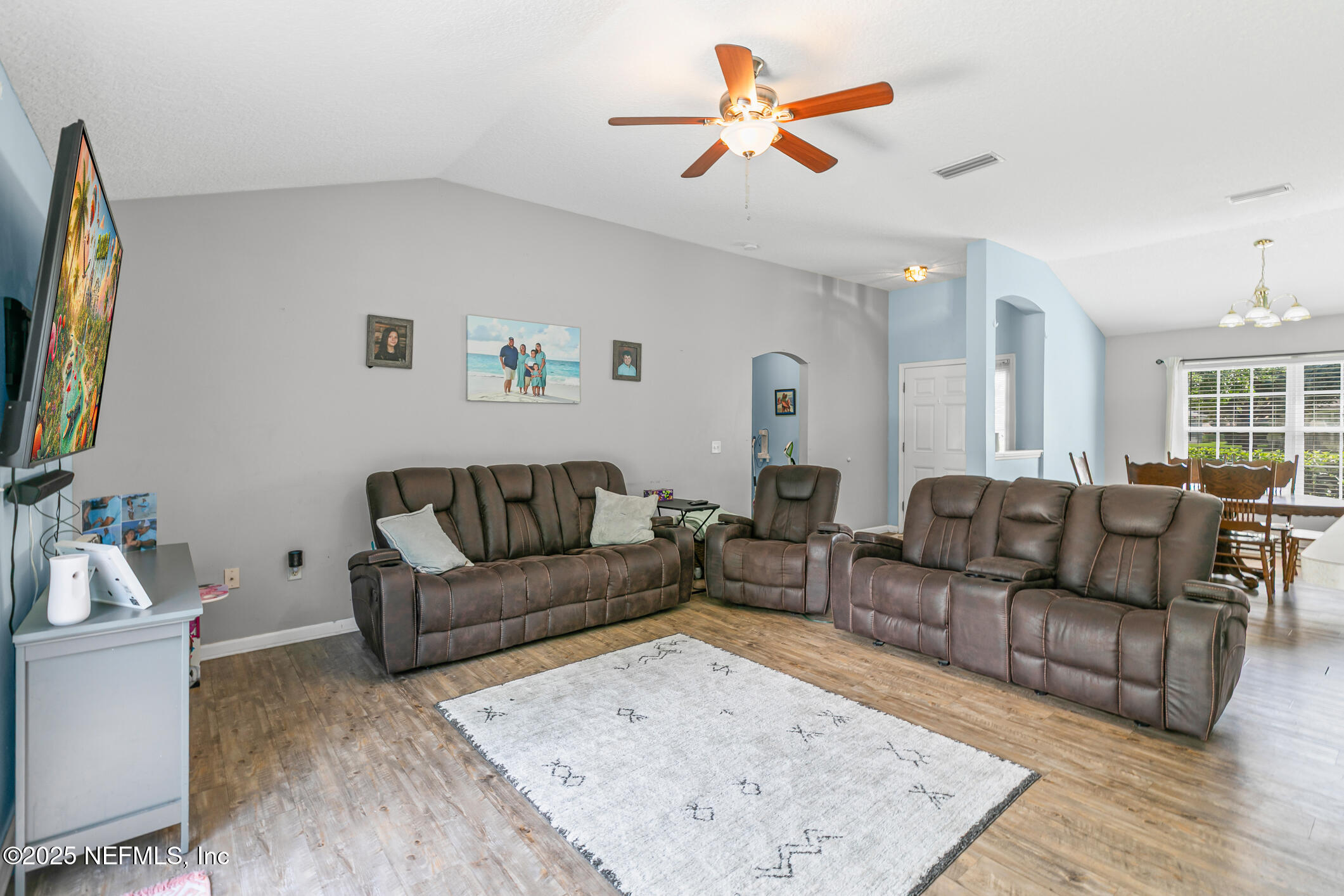 1725 South Summer Ridge Court St. Augustine, FL 32092 - Photo 19 of 46 a living room with furniture wooden floor and a flat screen tv