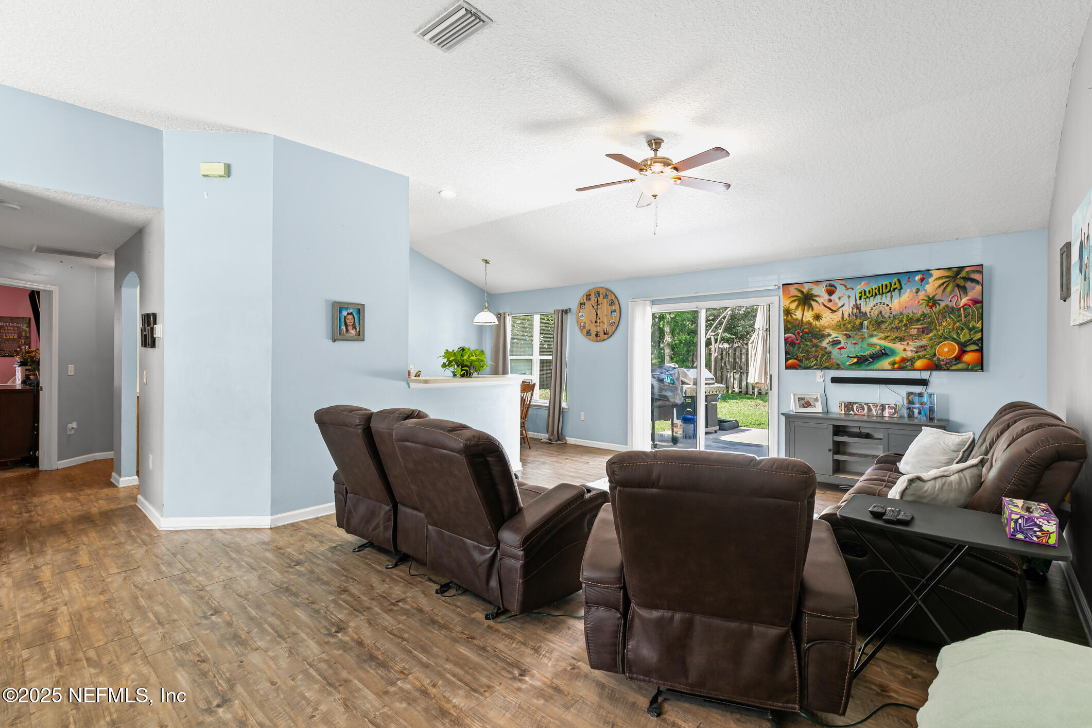 1725 South Summer Ridge Court St. Augustine, FL 32092 - Photo 21 of 46 a living room with furniture a ceiling fan and a window