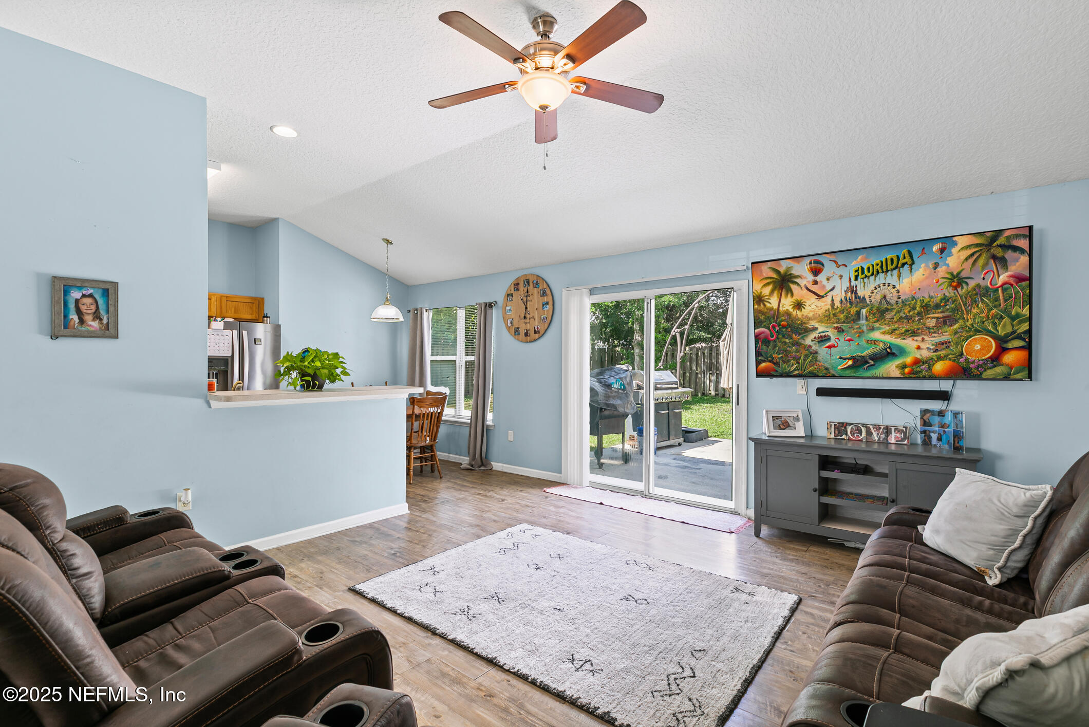 1725 South Summer Ridge Court St. Augustine, FL 32092 - Photo 22 of 46 a living room with furniture and a flat screen tv